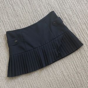 Black pleated mini skirt with hip buttons